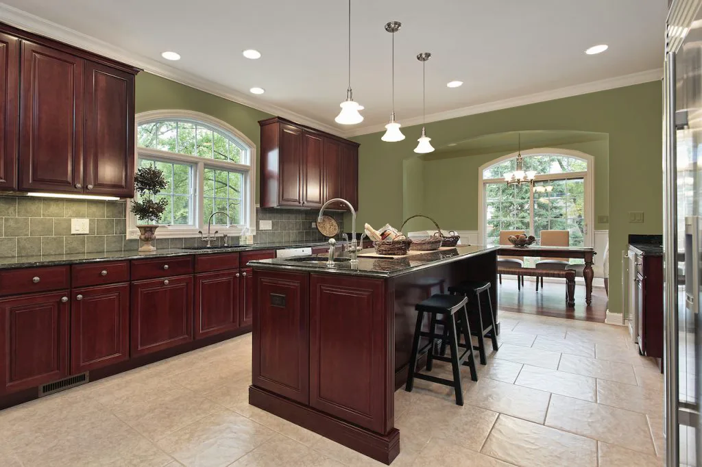 Sage Green Walls and Cherry Kitchen Cabinets