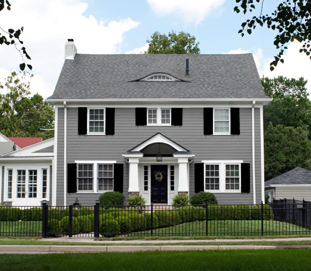 20 Captivating Shutter Colors To Transform Your Gray House   Bold Black Shutters With Gray House .webp