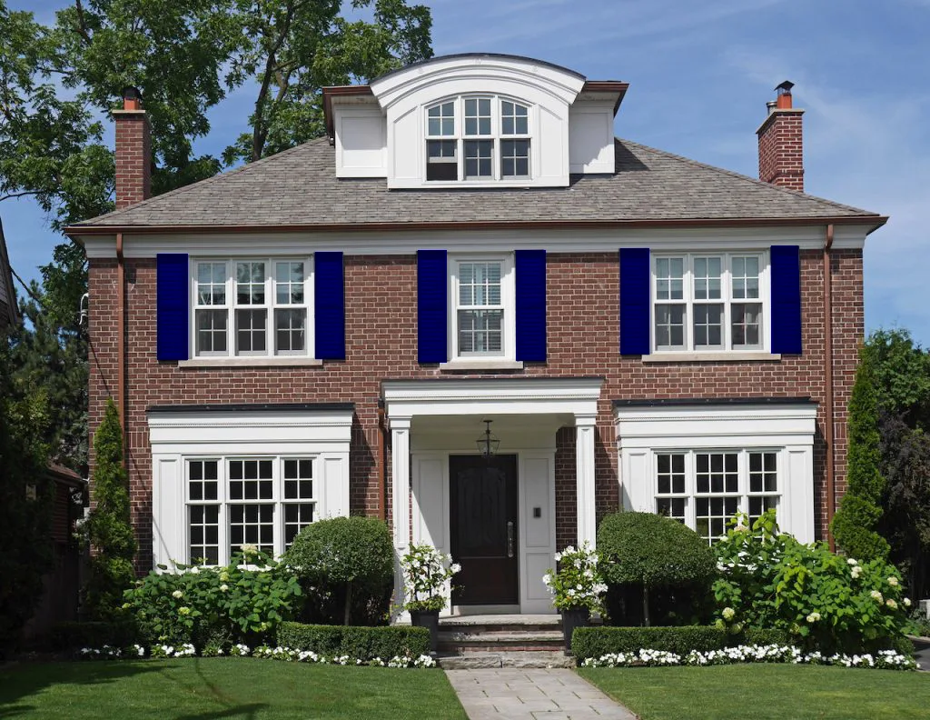 Navy Blue Shutters with Red Brick House