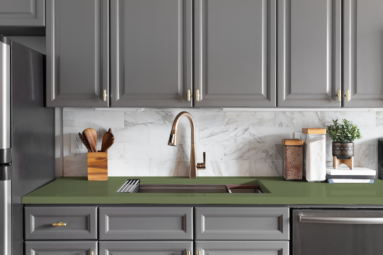 sage green quartz countertops with gray kitchen cabinets