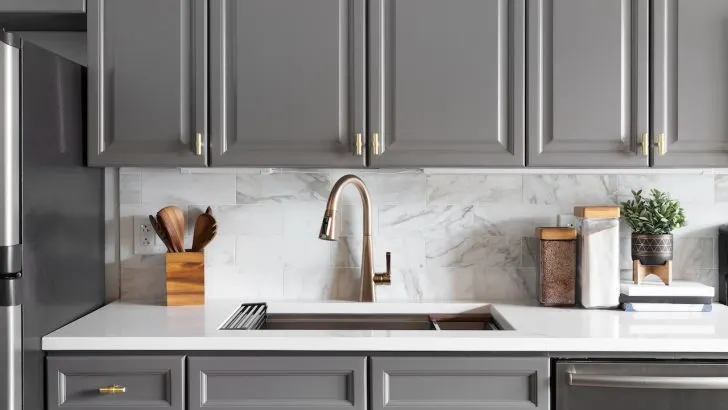 white quartz countertops with gray kitchen cabinets