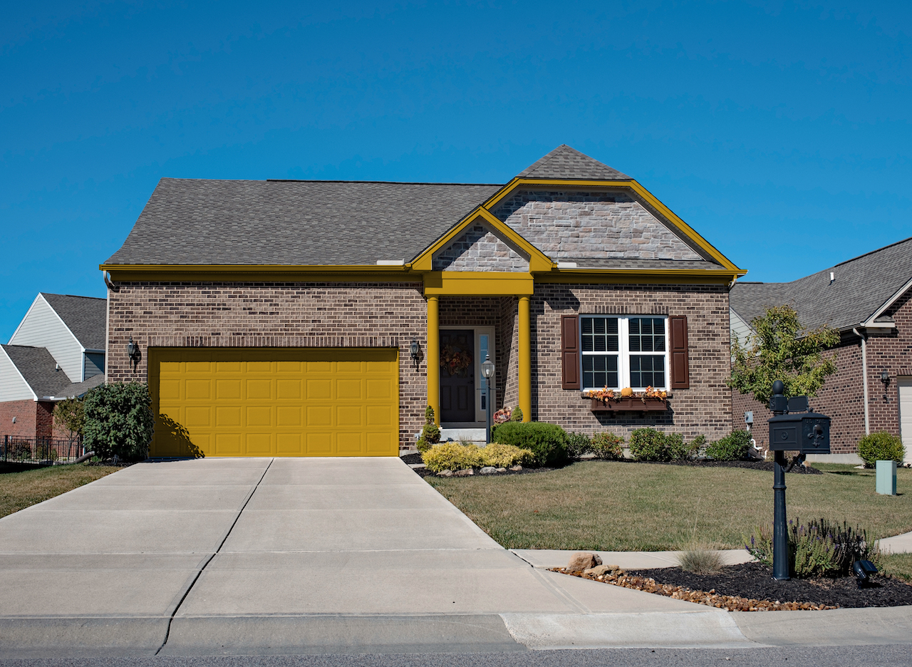 brown brick house with burnished gold trim